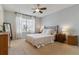 Cozy bedroom featuring a comfortable bed, nightstands and natural light at 10518 Hyacinth Pl, Highlands Ranch, CO 80129
