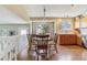 Dining area with a wooden table, pendant lighting, and open floor plan at 10518 Hyacinth Pl, Highlands Ranch, CO 80129