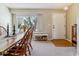 Bright dining room with a large window, wood floors, and a dining table set for a meal at 10518 Hyacinth Pl, Highlands Ranch, CO 80129
