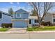 Charming two-story home with a well-maintained lawn, a two-car garage, and lovely curb appeal at 10518 Hyacinth Pl, Highlands Ranch, CO 80129