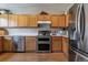 Bright kitchen features stainless steel appliances and ample cabinet space at 10518 Hyacinth Pl, Highlands Ranch, CO 80129