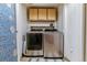 A spacious laundry room with modern, stainless-steel washer and dryer at 10518 Hyacinth Pl, Highlands Ranch, CO 80129