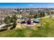 Aerial view of a colorful playground, walking paths, and neighborhood homes at 10518 Hyacinth Pl, Highlands Ranch, CO 80129