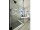 Bathroom featuring frameless glass shower and soaking tub at 9668 Salem Ct, Highlands Ranch, CO 80130