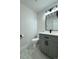 Bathroom features gray vanity with white countertop, black fixtures, and modern finishes at 9668 Salem Ct, Highlands Ranch, CO 80130