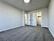 Bedroom featuring gray carpet, neutral paint, closet, and doorway leading to hallway at 9668 Salem Ct, Highlands Ranch, CO 80130