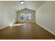 Bedroom with vaulted ceiling, hardwood floors, and window for natural light at 9668 Salem Ct, Highlands Ranch, CO 80130