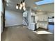 Open-concept living area featuring hardwood floors, fireplace, staircase, and eat-in kitchen at 9668 Salem Ct, Highlands Ranch, CO 80130