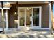 Covered patio features sliding glass doors that lead into a bright modern kitchen at 9668 Salem Ct, Highlands Ranch, CO 80130
