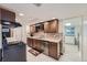 Functional kitchen with modern appliances, tile backsplash, and ample counter space at 2701 S Knox Ct, Denver, CO 80236