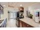 Kitchen with stainless steel appliances and access to backyard at 2701 S Knox Ct, Denver, CO 80236