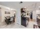 Kitchen area featuring updated appliances with sight lines to the dining area at 2701 S Knox Ct, Denver, CO 80236