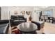 Comfortable living area featuring leather furniture, a unique coffee table, and an open layout at 2701 S Knox Ct, Denver, CO 80236