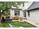 Relaxing backyard with a patio, outdoor dining, built-in grill, and a hammock for enjoying sunny afternoons at 8276 E 28Th Dr, Denver, CO 80238