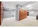 Spacious basement with plush carpet and built-in storage, ready to be customized for entertainment or relaxation at 8276 E 28Th Dr, Denver, CO 80238