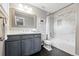Bathroom featuring a tub and shower combination and a vanity with a framed mirror at 8276 E 28Th Dr, Denver, CO 80238