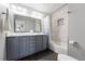 Bathroom features double vanity with modern fixtures and shower/tub with tile surround at 8276 E 28Th Dr, Denver, CO 80238
