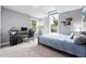 Well-lit bedroom with a desk and ample natural light at 8276 E 28Th Dr, Denver, CO 80238