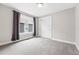 A clean and simple bedroom with a large window, closet and neutral color scheme at 8276 E 28Th Dr, Denver, CO 80238