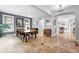 Spacious dining room with hardwood floors, natural light, and stylish decor at 8276 E 28Th Dr, Denver, CO 80238