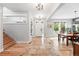 Inviting entryway with hardwood floors, staircase and decorative lighting at 8276 E 28Th Dr, Denver, CO 80238