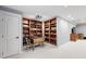 Basement features built in bookcases and a games table with chairs at 8276 E 28Th Dr, Denver, CO 80238
