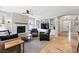 Cozy living room with a stone fireplace, built-in shelving and hardwood floors at 8276 E 28Th Dr, Denver, CO 80238