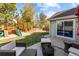 Backyard with patio and outdoor seating area, playset, and privacy fence at 10101 E 112Th Way, Commerce City, CO 80640