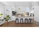 Modern kitchen featuring a large island with bar stool seating and stainless steel appliances at 10101 E 112Th Way, Commerce City, CO 80640