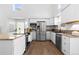 Modern kitchen featuring stainless steel appliances, granite counters, and hardwood floors at 10101 E 112Th Way, Commerce City, CO 80640