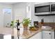 Granite counters and stainless steel microwave above the cooktop at 10101 E 112Th Way, Commerce City, CO 80640