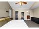 Bedroom with a black door, a bookcase, and a dresser at 10101 E 112Th Way, Commerce City, CO 80640