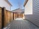 View of private backyard deck in winter with wood fencing at 5755 Boston St, Denver, CO 80238