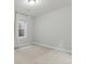 Minimalist bedroom with gray carpet, recessed lighting, window, and white trim, freshly painted at 5755 Boston St, Denver, CO 80238