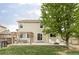 Enjoy the backyard patio with a pergola, outdoor dining, and lounge chairs perfect for relaxation and entertaining at 6385 S Nelson Way, Littleton, CO 80127