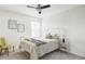 Bright bedroom with a ceiling fan, neutral decor, and a comfortable bed at 6385 S Nelson Way, Littleton, CO 80127