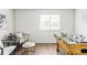 Bright recreation room featuring a table-tennis table, comfortable seating and natural light at 6385 S Nelson Way, Littleton, CO 80127