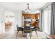 Open-concept kitchen and dining area featuring modern appliances, wood cabinets, and a seamless flow for entertaining at 6385 S Nelson Way, Littleton, CO 80127
