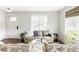 Inviting living room featuring neutral tones, plush seating, and ample natural light, creating a cozy and welcoming atmosphere at 6385 S Nelson Way, Littleton, CO 80127