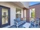Stylish balcony with comfortable seating offers a cozy outdoor living space and urban views at 3795 Depew St # D, Wheat Ridge, CO 80212