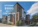 Modern townhome with brick accents, offering $5000 seller concession, set against a bright blue sky at 3795 Depew St # D, Wheat Ridge, CO 80212