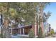 Modern townhomes with brick accents, covered balconies, and mature trees create a welcoming streetscape at 3795 Depew St # D, Wheat Ridge, CO 80212