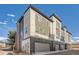 Contemporary townhouse with modern siding, attached two-car garage, and well-maintained landscaping at 3795 Depew St # D, Wheat Ridge, CO 80212