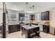 Modern kitchen with an island, stainless appliances, and hardwood floors at 3795 Depew St # D, Wheat Ridge, CO 80212