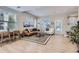 Bright living room boasts natural light, a comfortable seating area, wood floors, and a decorative rug at 3795 Depew St # D, Wheat Ridge, CO 80212