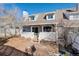 Home's backyard with deck and wood pile at 10395 Red Mountain E, Littleton, CO 80127