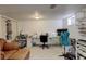 Finished basement room with sewing station and work area at 10395 Red Mountain E, Littleton, CO 80127