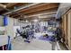 Unfinished basement with home gym setup at 10395 Red Mountain E, Littleton, CO 80127