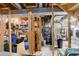 Unfinished basement with storage and laundry at 10395 Red Mountain E, Littleton, CO 80127