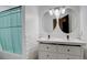 Bathroom with double sinks and a shower/tub combo at 10395 Red Mountain E, Littleton, CO 80127